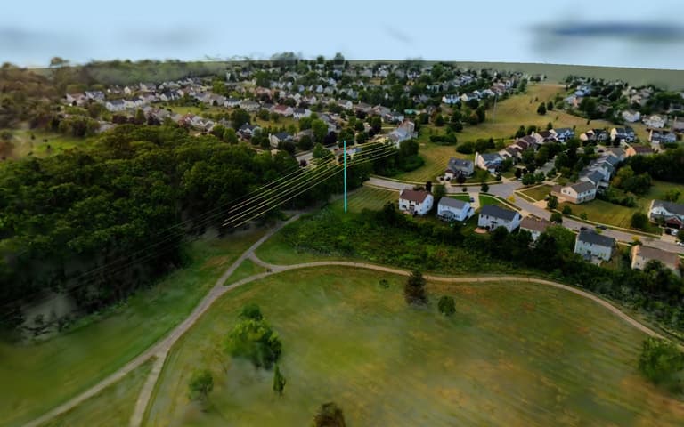 Photoreal model of a utility corridor beside a neighbourhood, with fitted power lines and a pole drawn on top